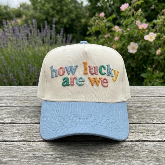 Front view of how lucky are we embroidered cap outdoors