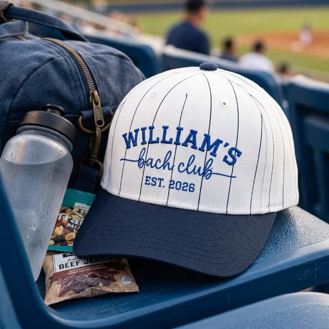 William’s Beach Club pinstripe baseball hat with navy brim displayed at a baseball game