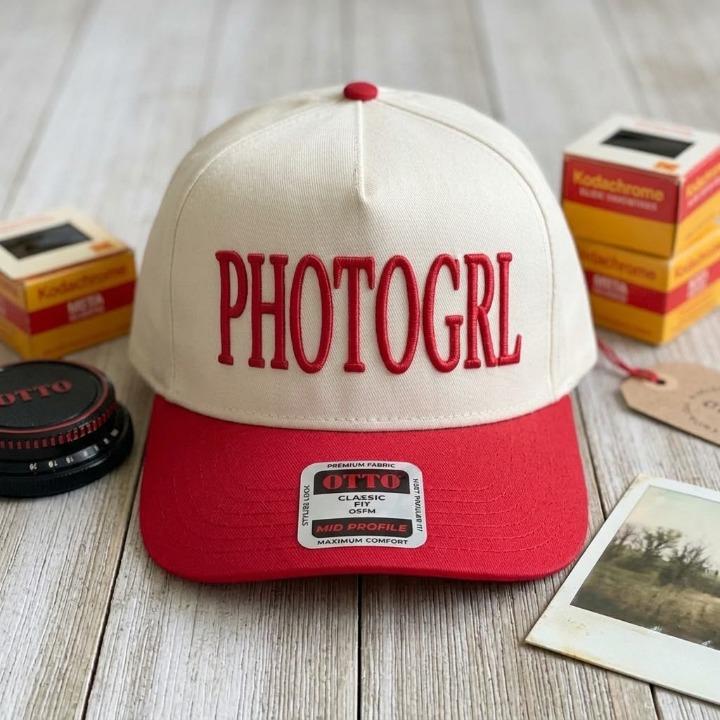 Cream and red cap with bold PHOTOGRL lettering