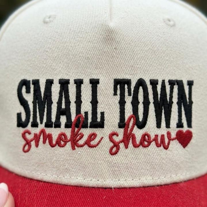 Close-up view of the black and red embroidered Small Town Smoke Show design