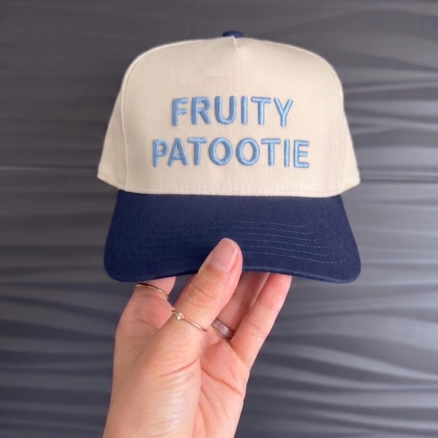 Fruity Patootie' embroidered two-tone cap with beige top and dark blue brim