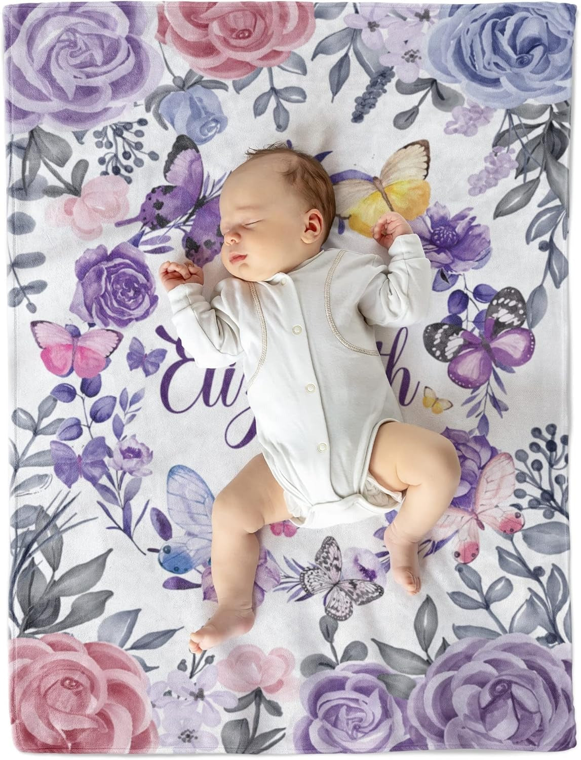 Newborn baby girl sleeping on personalized blanket with name Elizabeth and purple butterfly design