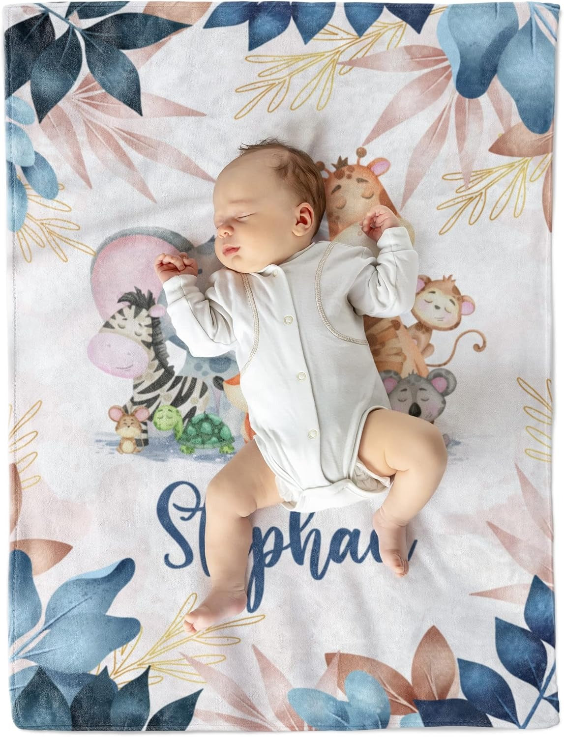 Baby lying on soft fleece custom baby blanket with safari animals