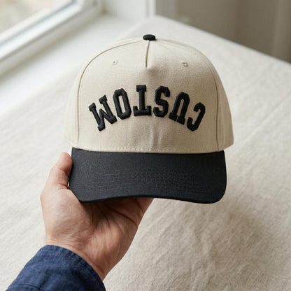 Two-tone khaki and black hat with raised CUSTOM embroidery