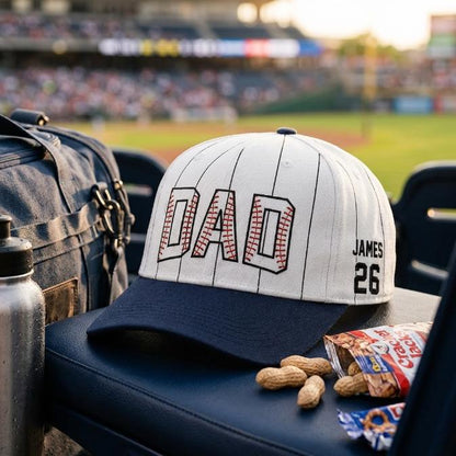 DAD pinstripe baseball hat with navy bill and James 26 side detail at a baseball stadium