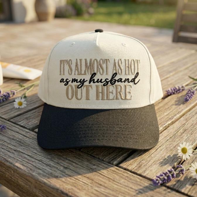 Close-up of a humorous husband quote embroidered on a two-tone trucker cap