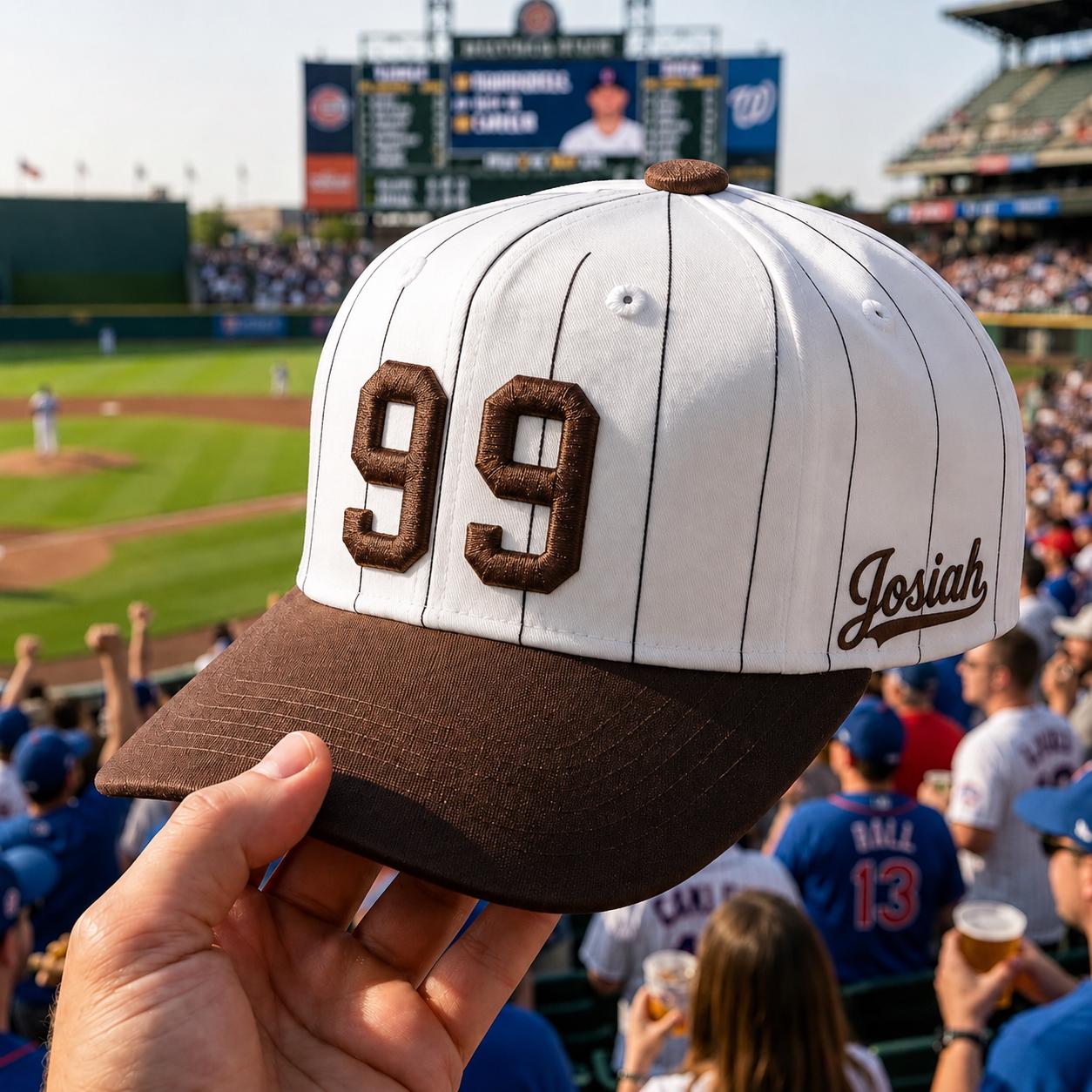 White pinstripe baseball hat with brown embroidered number 99 and Josiah name detail