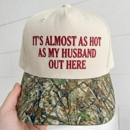 Close-up of embroidered “It’s Almost as Hot as My Husband Out Here” hat