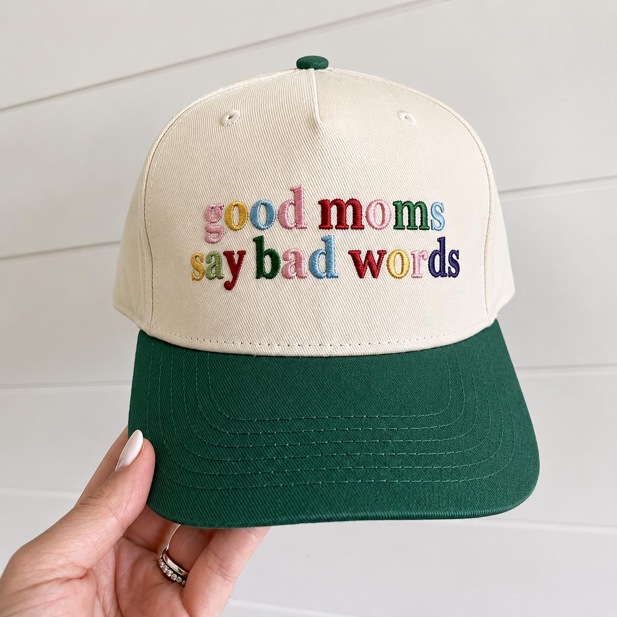 Cream and forest green two-tone cap with colorful “good moms say bad words” embroidery