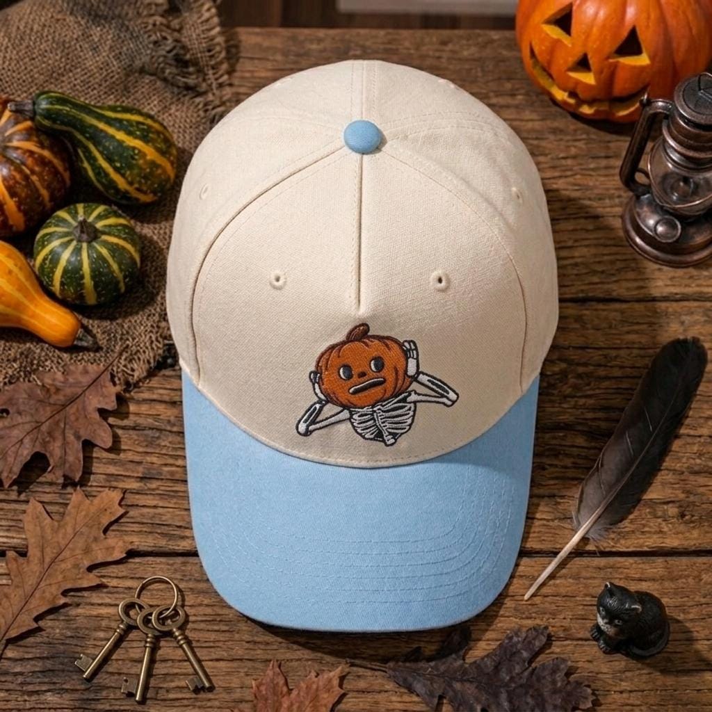 Top view of cream and light blue pumpkin skeleton hat
