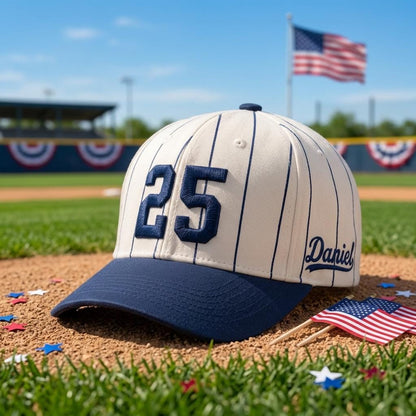 Pinstripe baseball hat with number 25 shown at a baseball field