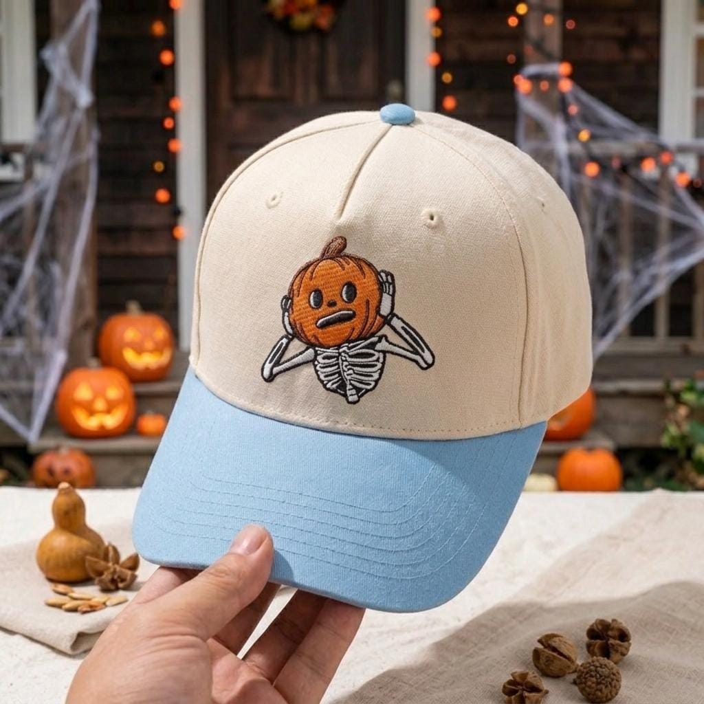 Angled view of embroidered pumpkin skeleton Halloween hat