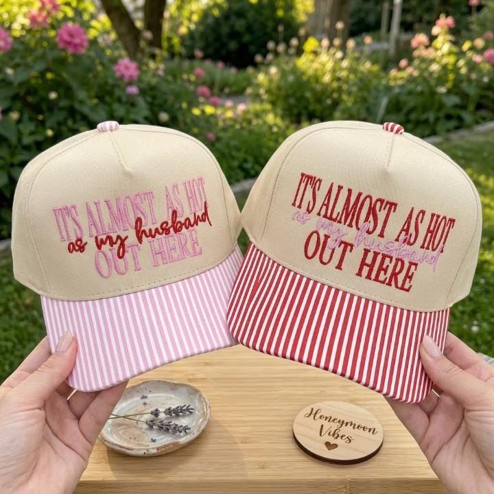 Two embroidered couple hats with khaki crowns and pink and red striped brims