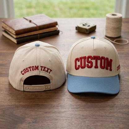 Front and back views of a custom text snapback hat on a wooden table