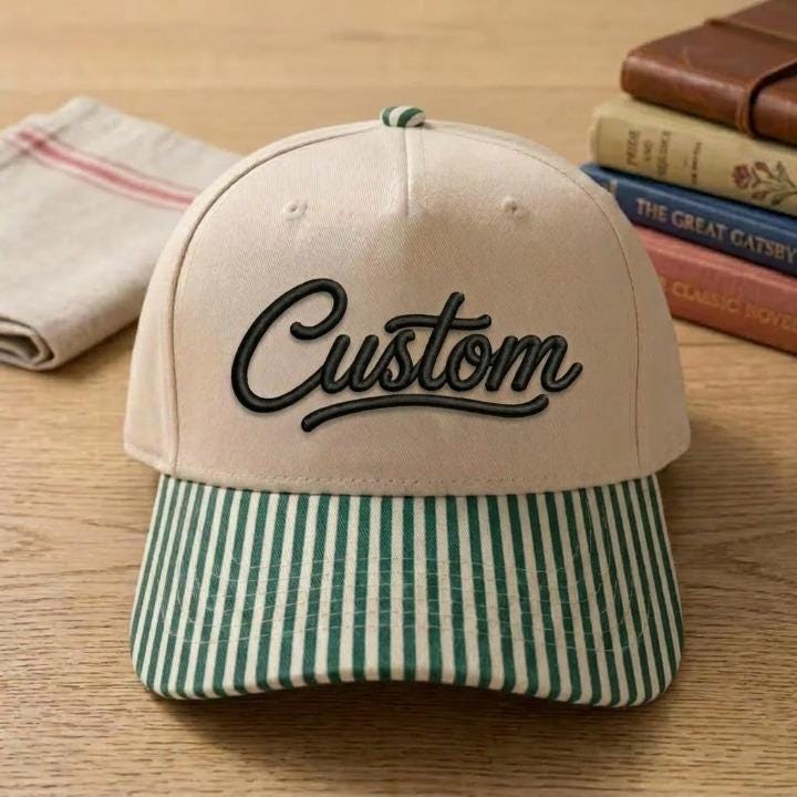 Cream Custom script hat with green-and-white striped bill