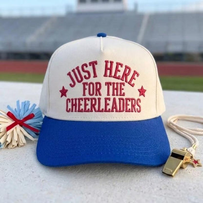 Two-tone royal blue and cream cheerleader supporter hat displayed at a stadium