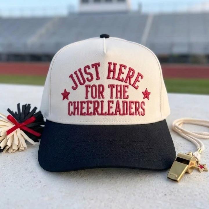 Two-tone black and cream hat with Just Here for the Cheerleaders embroidery