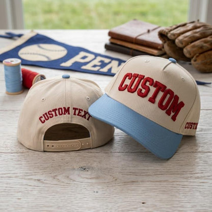 Personalized light crown snapback hat with red custom text and blue contrast brim