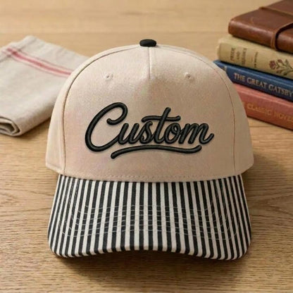 Cream embroidered hat with black-and-white striped bill