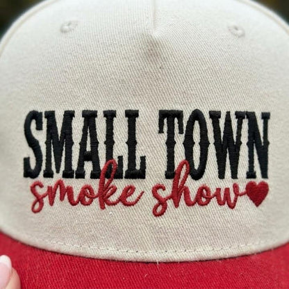 Close-up view of the black and red embroidered Small Town Smoke Show design