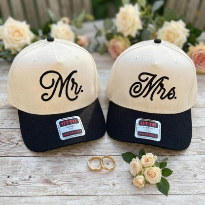 Mr. and Mrs. wedding hats styled with wedding rings and roses