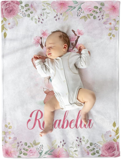 Newborn baby girl sleeping on custom baby blanket with name Rosabella, soft fleece with floral design