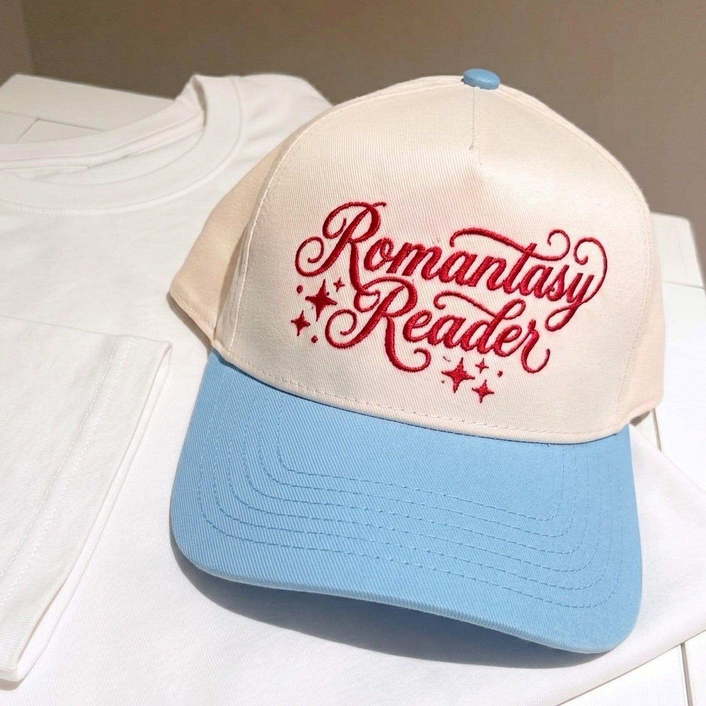 Romantasy Reader baseball cap with red embroidery and light blue brim