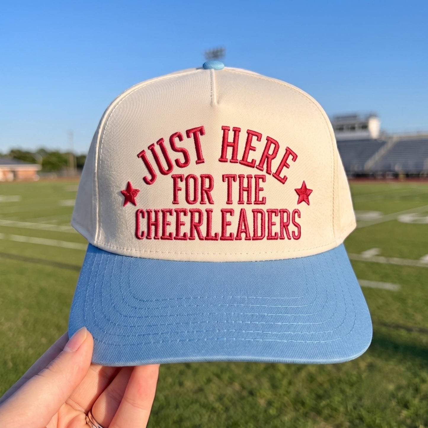 Funny baseball cap with 'Just Here for the Cheerleaders' red embroidery, cream and blue colors