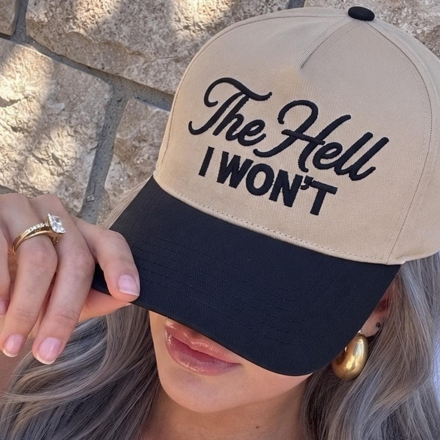Bold embroidered cap with empowering statement in beige and black color