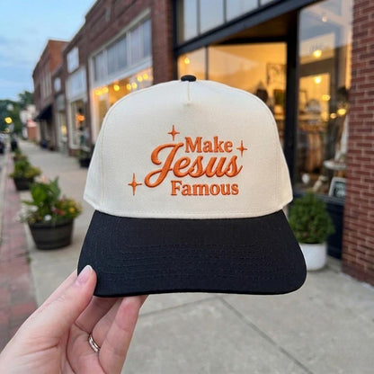 Make Jesus Famous' embroidered beige and black trucker cap with orange lettering