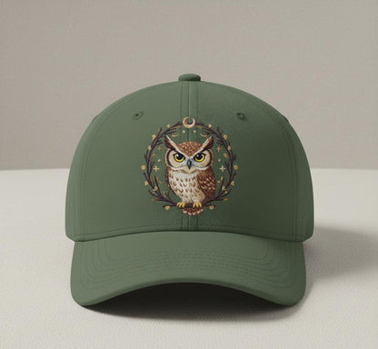 Olive green baseball cap with embroidered owl design and branch detailing