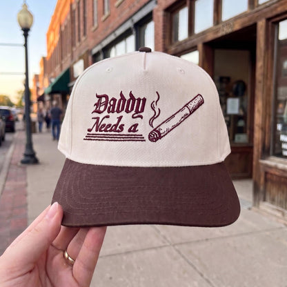 Vintage style baseball cap with cigar graphic, beige crown and brown brim